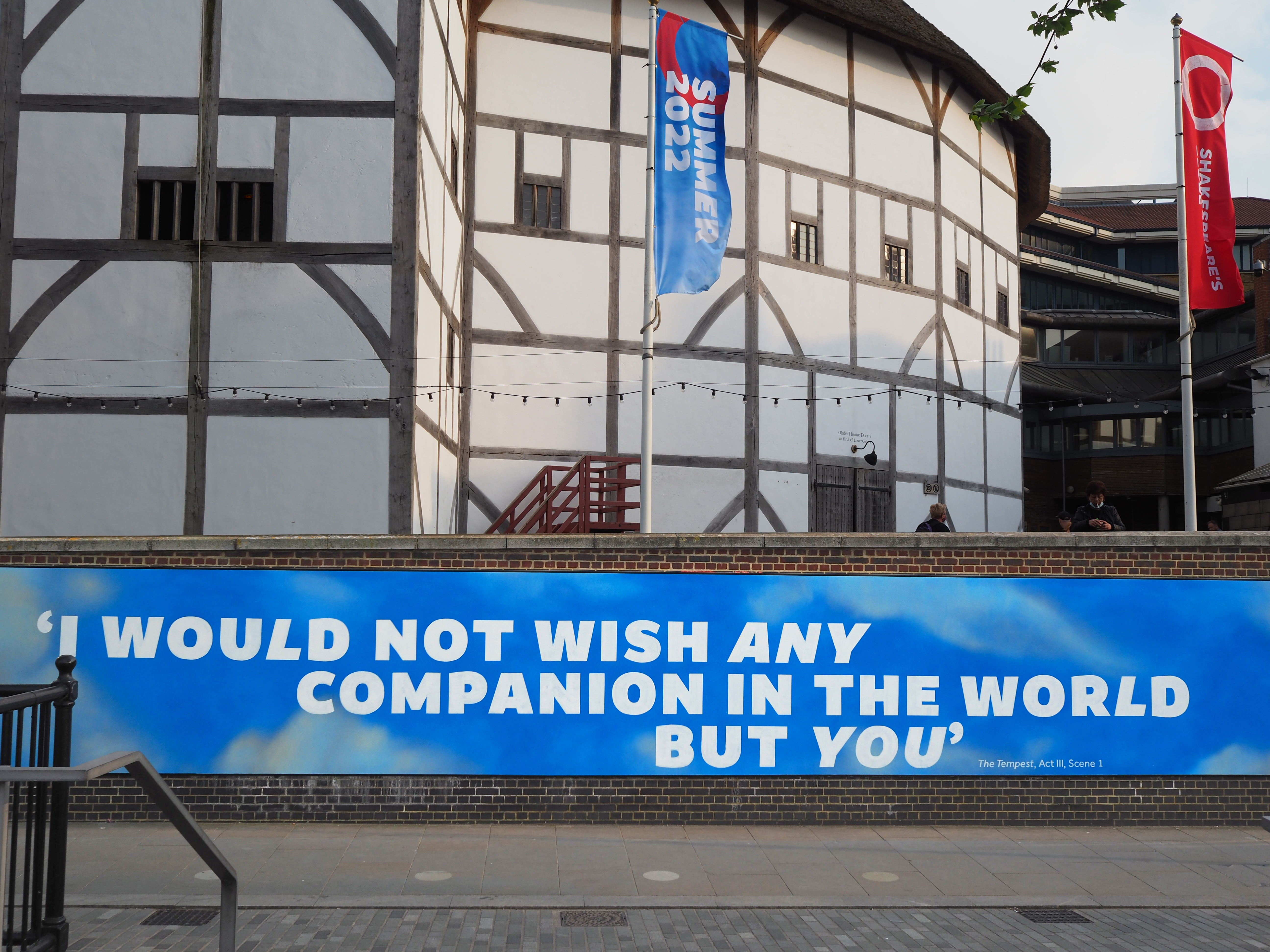 Amifer on a mural outside the Globe Theatre. The text says: I would not wish any companion in the world but you.